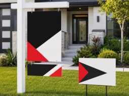 Custom real estate post sign, rider panel and directional yard sign at a home