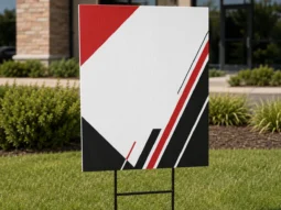 Custom full-color yard signs installed outdoors with H-stakes
