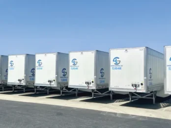 Coordinated fleet graphics installed across multiple commercial trailers