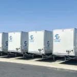 Coordinated fleet graphics installed across multiple commercial trailers