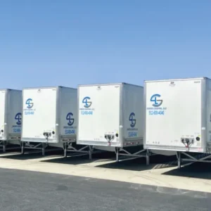 Coordinated fleet graphics installed across multiple commercial trailers