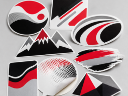 Assortment of custom printed vinyl decals and contour-cut stickers
