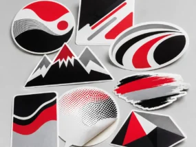 Assortment of custom printed vinyl decals and contour-cut stickers