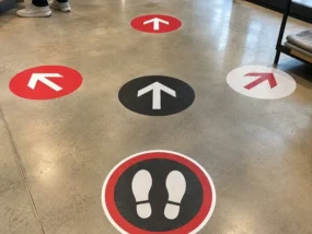 Custom Floor Graphics Custom directional and foot-position floor graphics installed on polished concrete
