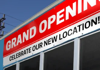Custom vinyl banner installed outside an Austin business