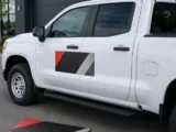 Custom magnetic vehicle sign installed on the door of a white work pickup truck
