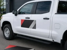 Custom magnetic vehicle sign installed on the door of a white work pickup truck