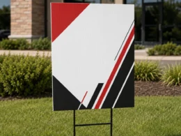 Custom full-color yard signs installed outdoors with H-stakes